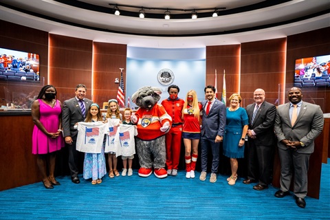 group of people in Commission Chambers recognized on partnership with IceDen